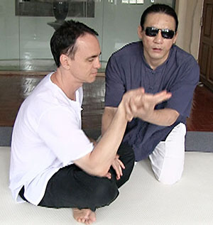 Yong Kiat instructs Daniel Carr in Bangkok.